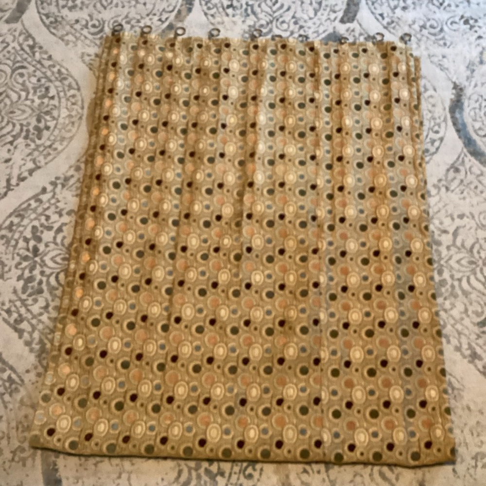 Four Custom made gold drapes with accent colors of green, blue, brown and cream.